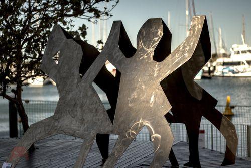 Metal children dancing in the sun