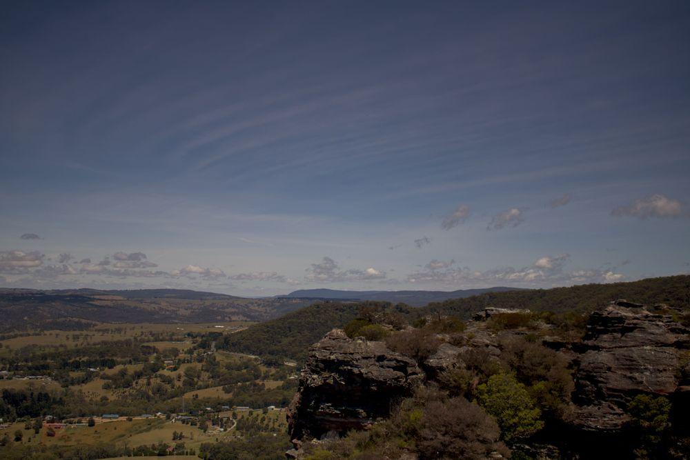 A sweeping view of a valley and the surrounding mountains